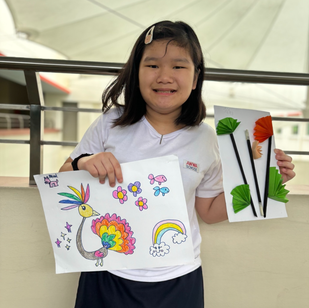 Student with her artwork